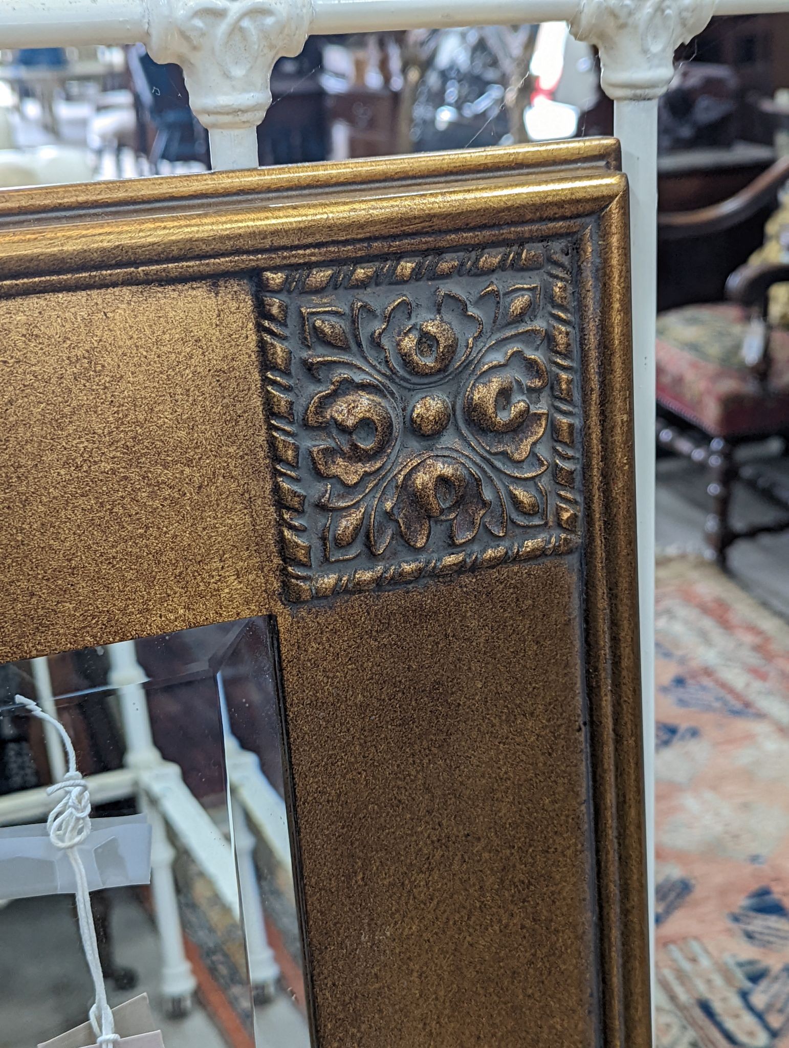 A modern gilt framed painted rectangular overmantel mirror, width 99cm, height 125cm